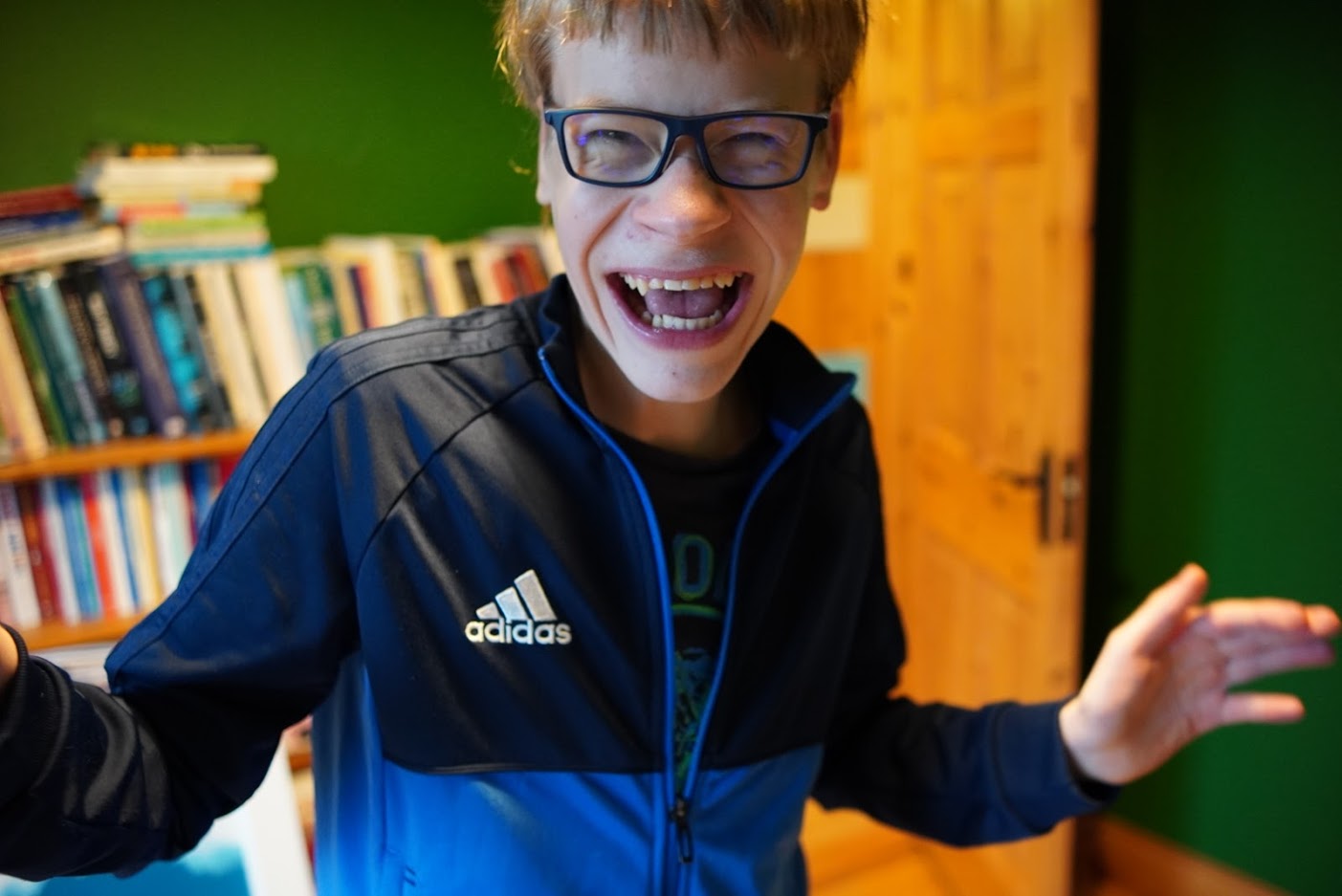 Laughing boy wearing glasses